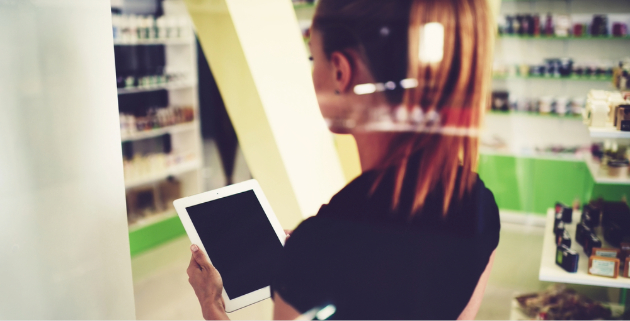 woman holding tablet in store