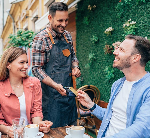 Man paying with card at a restaurant