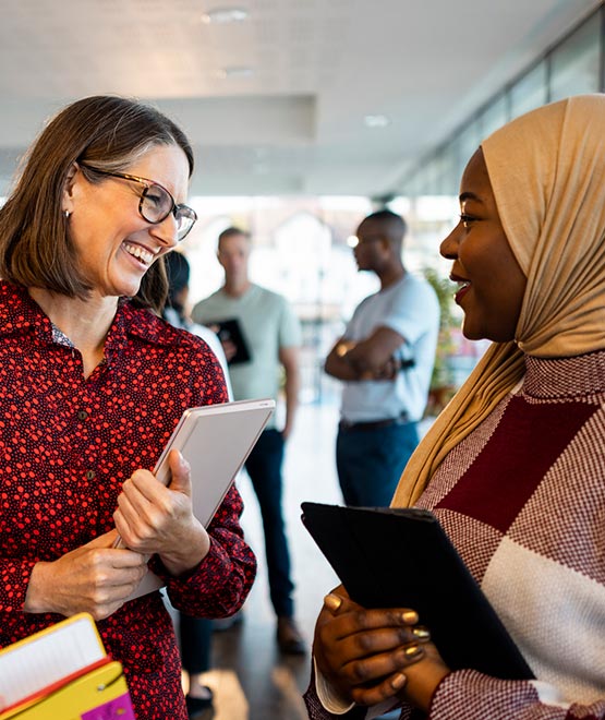 Coworkers with tablets in an office