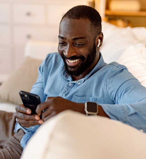 Man using his phone at home