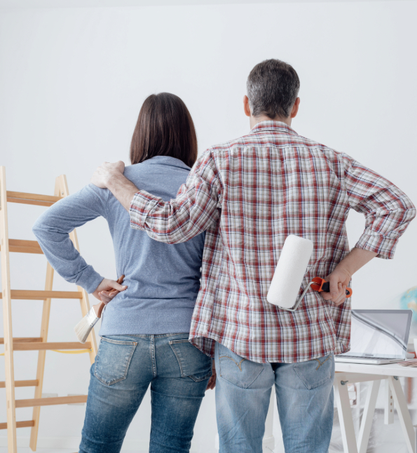 man and woman painting new house